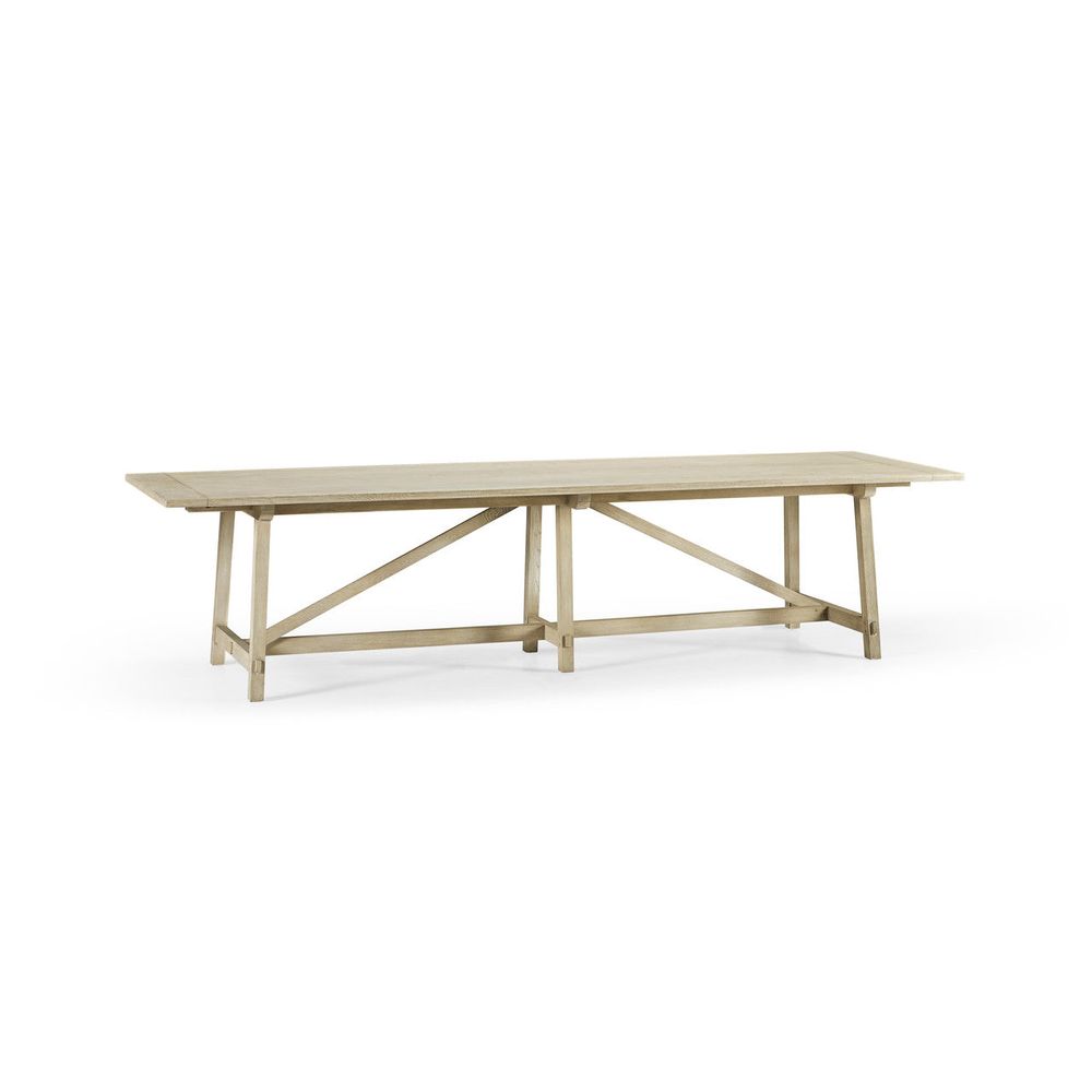 Timeless Sidereal French Laundry Dining Table 125" in Stripped Oak, shown in light natural oak and warm beige with oak wood.