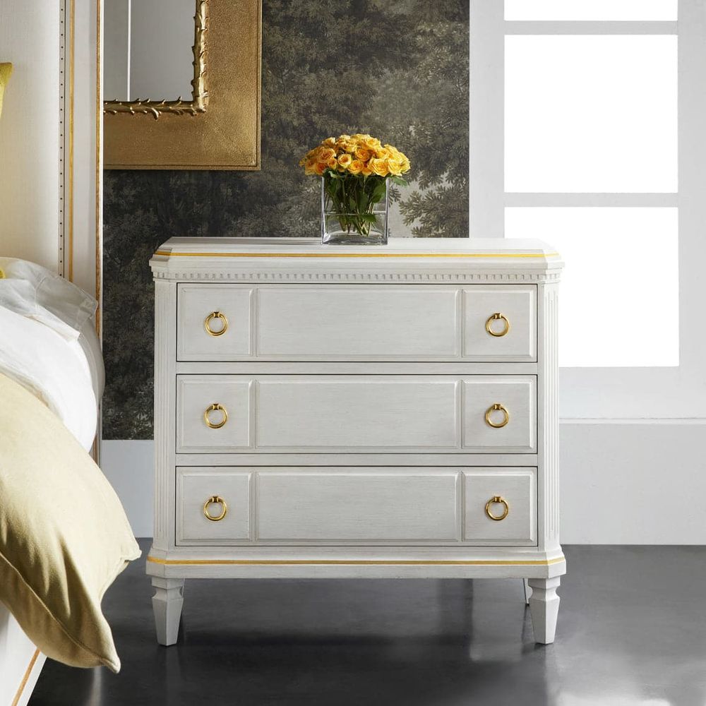 Covington Three Drawer Bedside Chest, shown in ivory white and off-white with wood and metal.