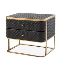 Bedside Table Monfort, shown in black and brass gold with leather, metal, and two stacked drawers.