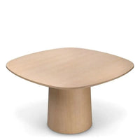 Dining Table Motto, shown in light natural wood and blonde beige with wood and a central pedestal base.