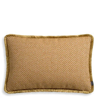 Cushion Kauai Rectangular, shown in amber and cream with linen, velvet, and shaggy fringe trim.