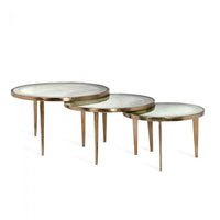Jan Circular Bunching Tables, shown in antique brass gold and champagne with metal and glass.