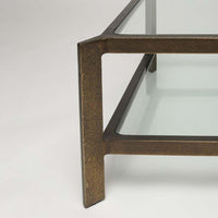 Additional view of Linley Cocktail Table in antique bronze and clear, featuring dual glass shelves.