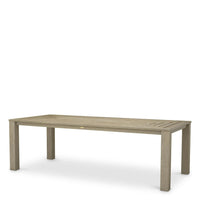 Outdoor Dining Table Vistamar Aged Teak, shown in light beige and taupe with teak and wood.