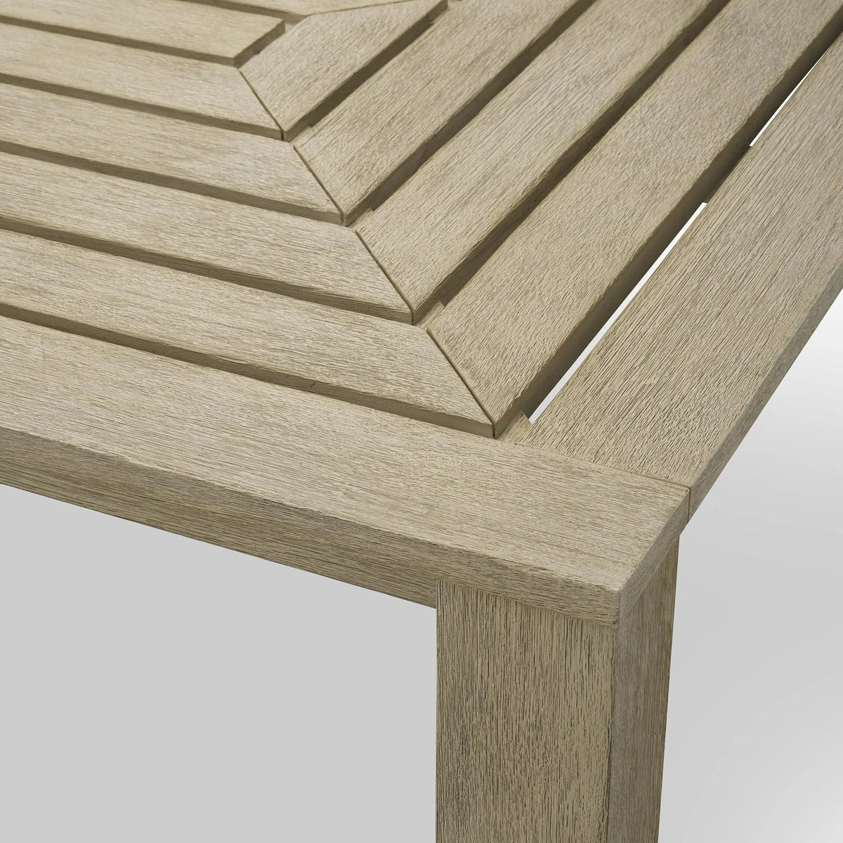 Additional view of Outdoor Dining Table Vistamar Aged Teak in light beige and taupe.