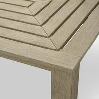 Additional view of Outdoor Dining Table Vistamar Aged Teak in light beige and taupe.