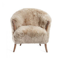 Ilaria Lounge Chair, shown in beige and cream with sheepskin fur, wood, and fixed integrated arms.