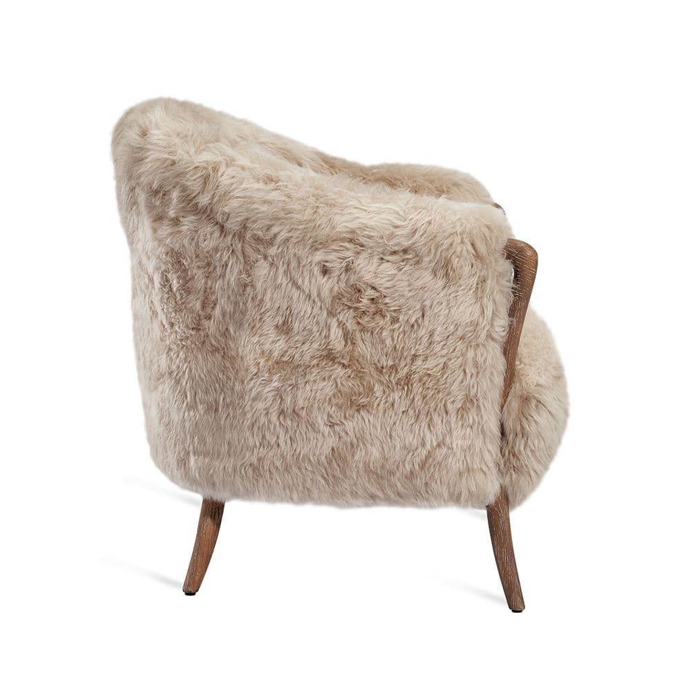Additional view of Ilaria Lounge Chair in beige and cream, featuring plush long-pile fur and fixed integrated arms.