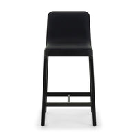 Florent Counter Stool, shown in black with vegan leather, wood, and fixed four-leg base.
