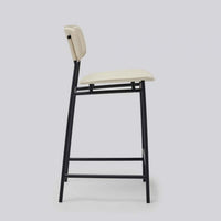 Additional view of Albert Counter Stool in cream and black, featuring smooth upholstery finish and integrated footrest rail.