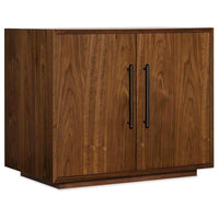 Elon Two-Door Cabinet, shown in medium walnut brown and warm medium-dark wood brown with wood and metal.