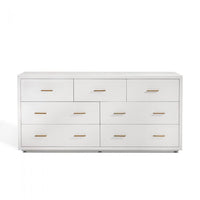 Livia 7 Drawer Chest, shown in white and off-white with fabric-wrapped wood, wood, and seven drawers of mixed widths.