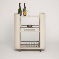 Alternate view of Holmes Bar Cart, featuring frosted glass finish, woven cane or rattan, wood, and open multi-tier shelving.