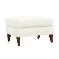 Kelsey Ottoman, shown in ivory and cream with fabric upholstery, wood legs, and fixed tapered wood legs.