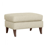 Additional view of Kelsey Ottoman in ivory and cream, featuring fixed tapered wood legs.