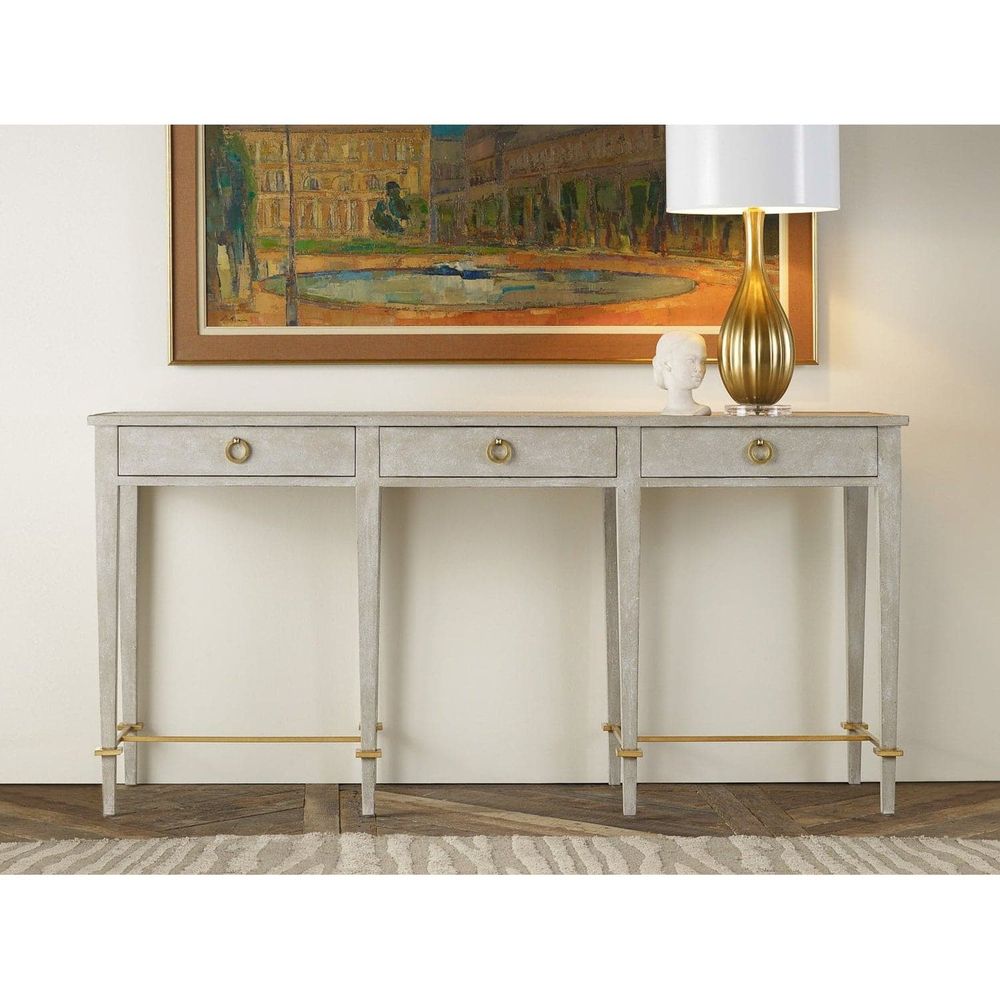 Modernist Console, shown in light gray and silver with wood, metal, and three full-width drawers with ring pulls.