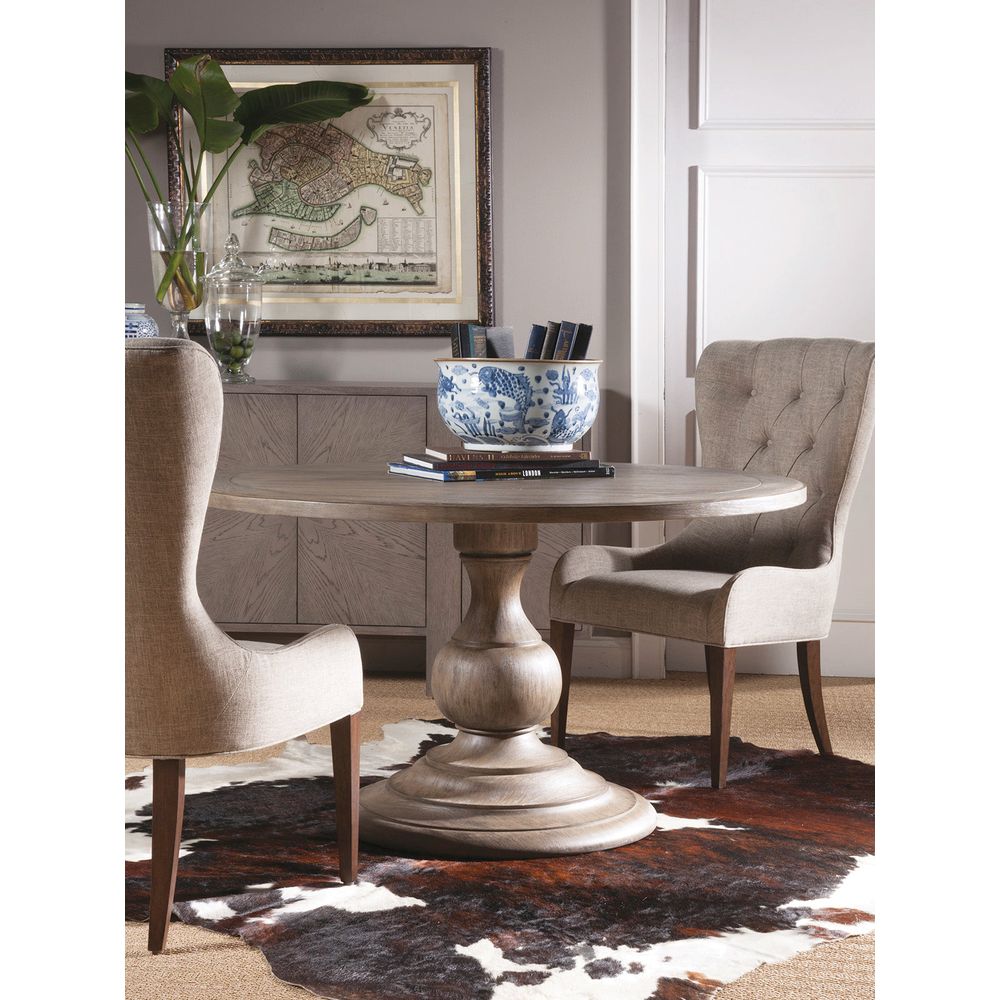 Alternate view of Axiom Round Dining Table, featuring weathered finish, wood, and a single central pedestal base.