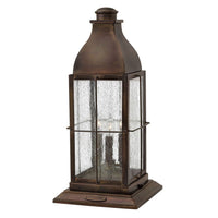 Outdoor Bingham, shown in dark bronze and charcoal black with metal, seeded glass, and a pier-mount pedestal base.