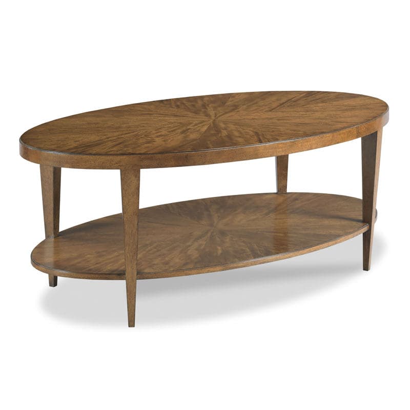 Stafford Oval Cocktail Table, shown in warm medium brown and golden amber brown with wood and hardwood solids.