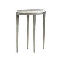 Brilliante Spot Table, shown in silver and ivory-white with metal, capiz shell, and a compact oval surface.