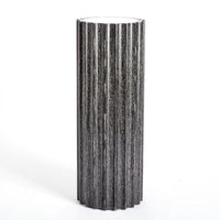 Reflective Column Pedestal, shown in black and charcoal with wood, mirror, and a flat display top surface.