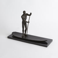 SUP Sculpture, shown in bronze and black with bronze, stone, and freestanding sculptural form.