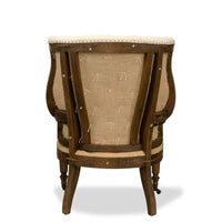 Additional view of Irish Chair in cream and ivory, featuring deep button tufting and fixed arms.