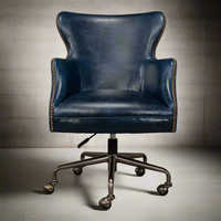 Additional view of Andrew Jackson Desk Chair in navy blue and indigo, featuring nailhead trim finish and a swivel base.