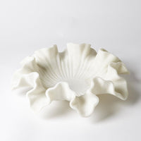 Marble Ruffle Bowl, shown in white and off-white with marble and open shallow vessel.