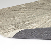 Additional view of Vortex Rug in ivory and natural beige, featuring textured relief finish and a dense textured pile surface.