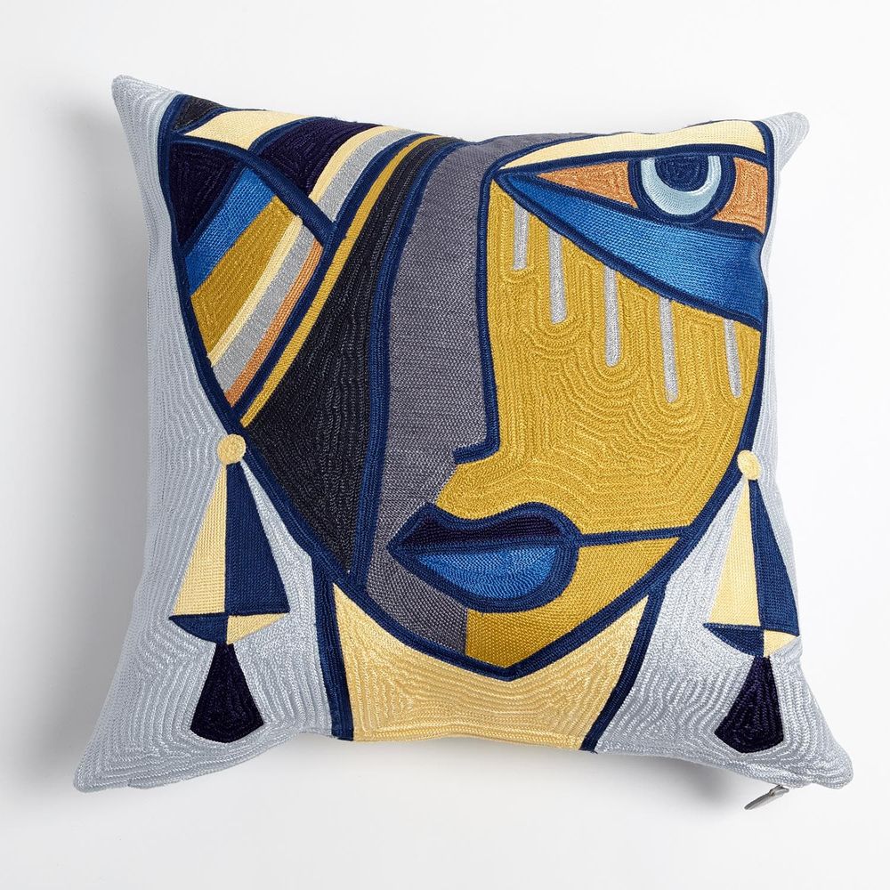Maya Pillow, shown in mustard yellow and navy blue with embroidered textile, woven fabric ground, and zipper closure.