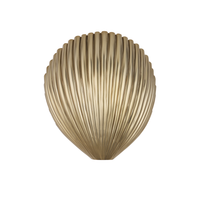 Alexine Wall Sconce, shown in antique brass gold with brass, iron, and wall-mounting hardware.
