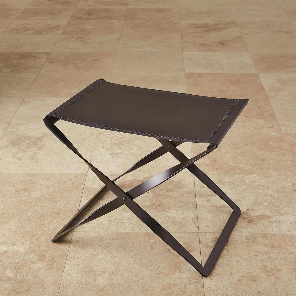 Folding Stool, shown in dark brown and espresso with leather, metal, and a folding x-frame base.