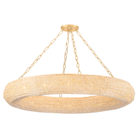 Lure Chandelier, shown in cream and ivory with wood beads, metal, and a ceiling-mounted canopy.