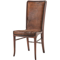 The Sweep Dining Chair, shown in medium brown and dark walnut brown with wood, hair-on hide, and armless.