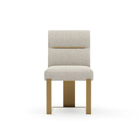 Counter Balance Dining Chair, shown in ivory and warm brass with textured fabric, metal, and armless.