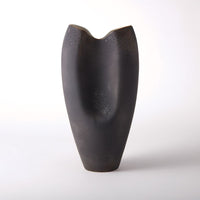 Oxus Pinched Vase, shown in charcoal black and dark espresso brown with ceramic.