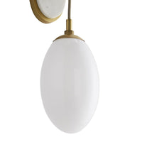 Additional view of Quinn Sconce in white and antique brass, featuring polished stone finish and wall-mounting hardware.