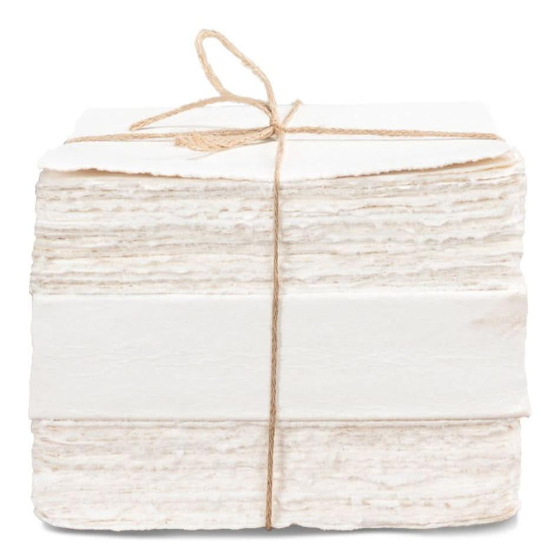 Ledger White Set Of 6, shown in white and off-white with handmade paper, jute twine, and twine-bound stack.