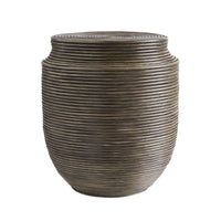 Wyatt End Table, shown in warm brown and taupe gray with rattan, cane, and a flat circular top surface.