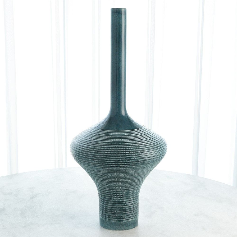 Ridged Bottle, shown in teal-green and blue-green with ceramic and narrow bottle neck opening.