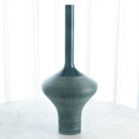 Ridged Bottle, shown in teal-green and blue-green with ceramic and narrow bottle neck opening.