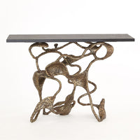 Drift Console, shown in bronze and charcoal with cast metal, stone, and a flat rectangular display top.