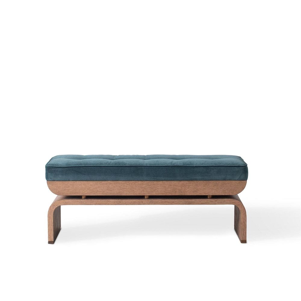 Ives Bench, shown in teal and medium walnut brown with velvet fabric, wood, and fixed bench seating.