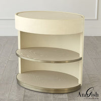 Ellipse Bedside Cabinet, shown in cream and beige with wood, metal, and integrated storage drawer with curved front.