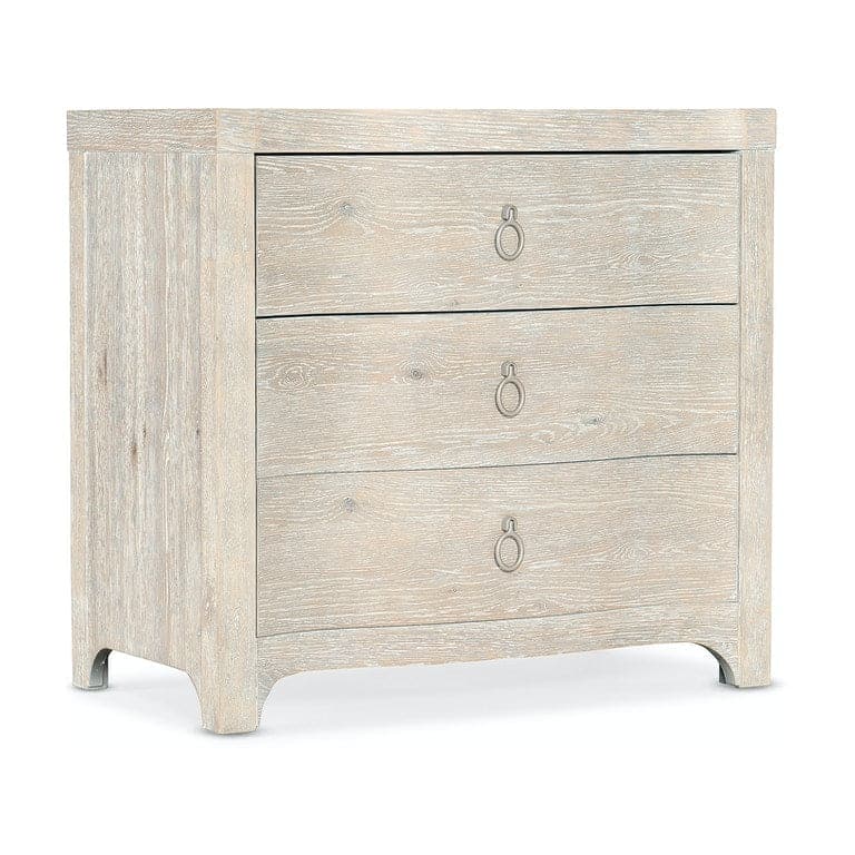 Antigua Three Drawer Nightstand, shown in light beige and weathered gray-white with wood and metal.