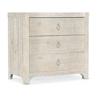 Antigua Three Drawer Nightstand, shown in light beige and weathered gray-white with wood and metal.