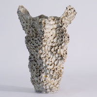 Barrier Reef Vase, shown in off-white and cream with ceramic and stoneware.