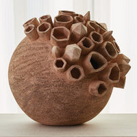 Chelsea Sculpture, shown in terracotta and warm brown with ceramic, clay, and hollow tubular openings.