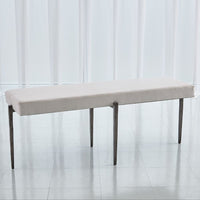 Laforge Bench, shown in cream and off-white with fabric, metal, and a backless seat.